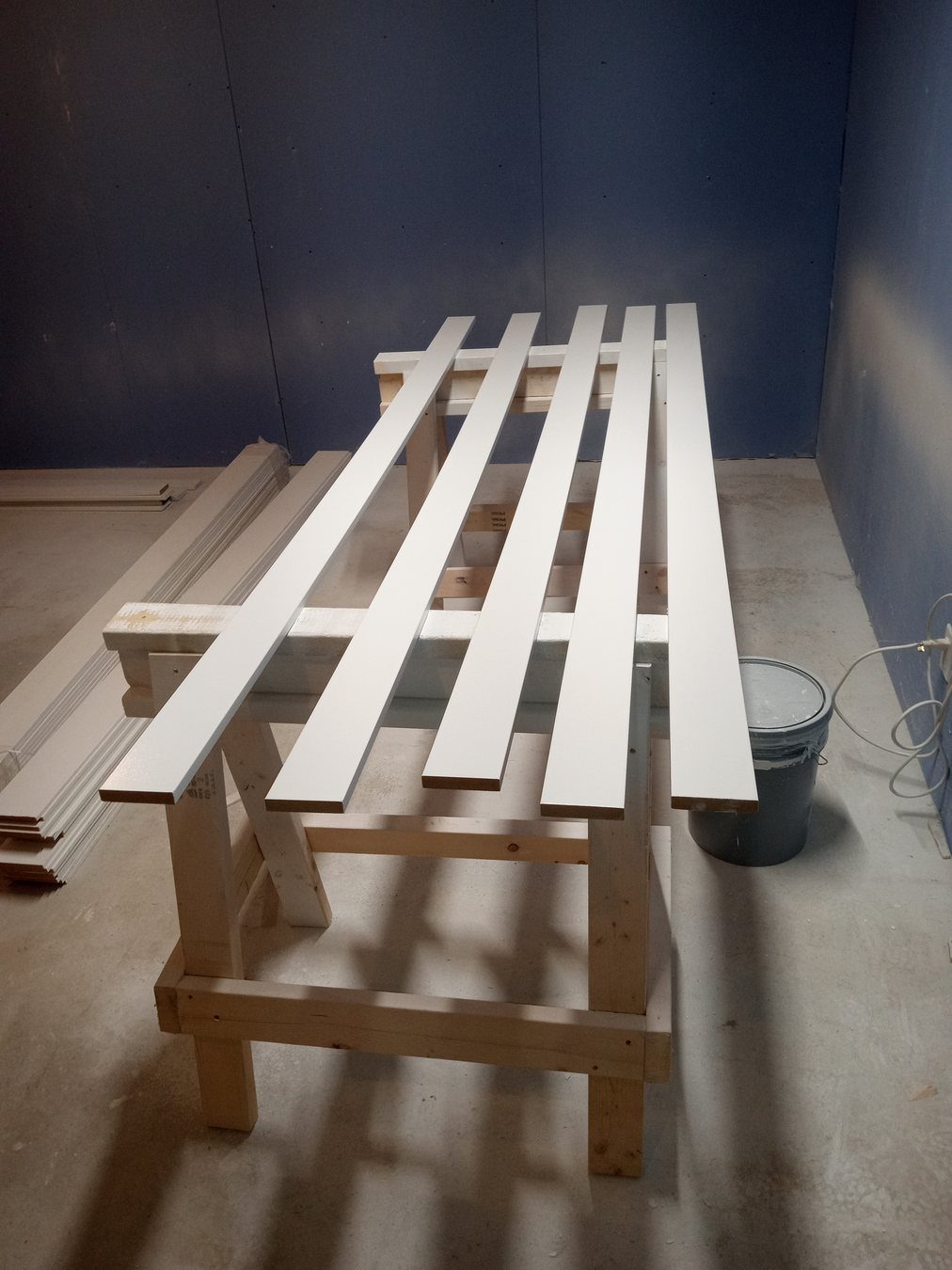Carpentry trim pieces staged for detailed finish work.